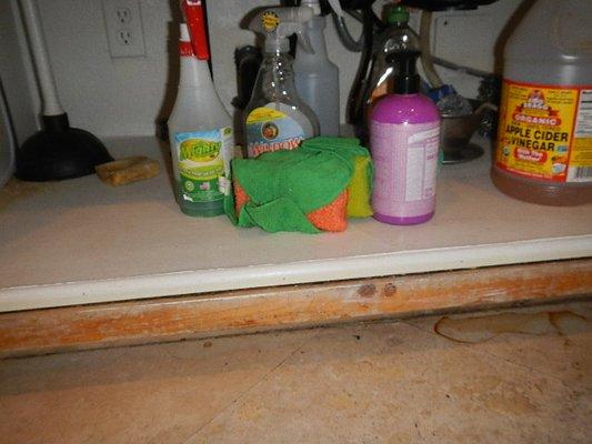 Doubled up platform under kitchen sink is a sure sign that water damage was covered over.