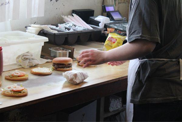 Finishing the burgers