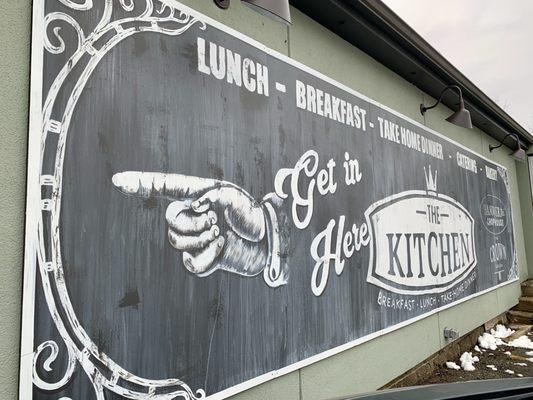 Side of store banner in the style of a vintage deli/grocer