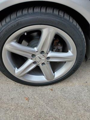 On the right side of rim, obvious fresh curb rash and dirt on tire.