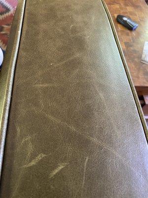 Scratched sofa leather.