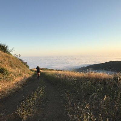 Riding above the spring fog... Zuma Beach hiding far below.