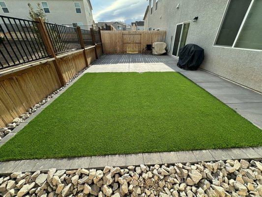 Artificial turf with paver border