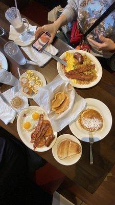 (Bottom left) Hungry Man Pancakes combo, Rye Toasts, Pancakes, Mama's eggs platter, Garlic Bread bun in the middle!