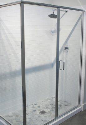 White subway shower surround with semi-euro shower enclosure.