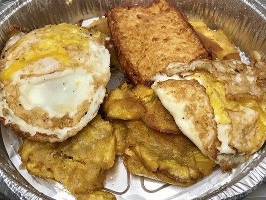 Fried Eggs with Mashed Green Plantains, Fried Cheese, and Salami Breakfast