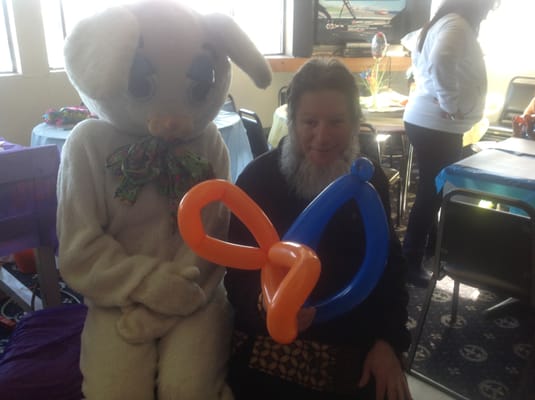 Me at the club twisting balloons for the children with the Easter bunny.