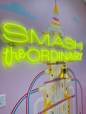 Smash the Ordinary neon sign and the bell you get to ring