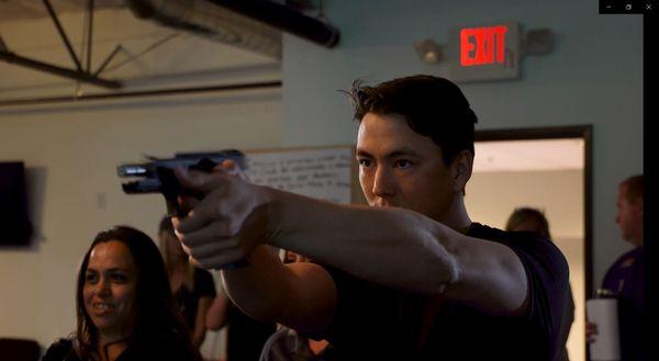 Student shooting on the VirTra 100 at Haley Strategic Partners during an Arizona Concealed Carry Course.