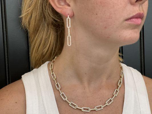 Woman wearing paperclip earrings and necklace