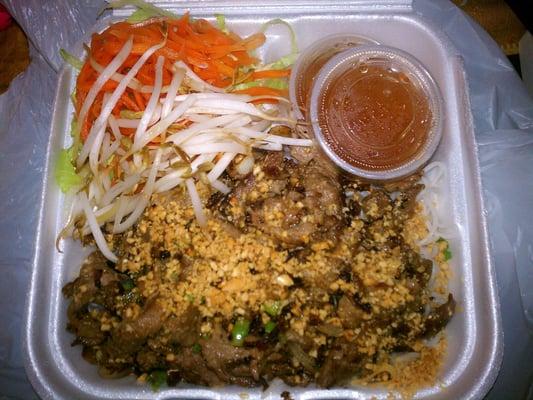 Beef with vermicelli noodles. Delicious! W/ crunchy bean sprouts, pickled carrot, crushed peanuts, and a sweet chili/fish sauce