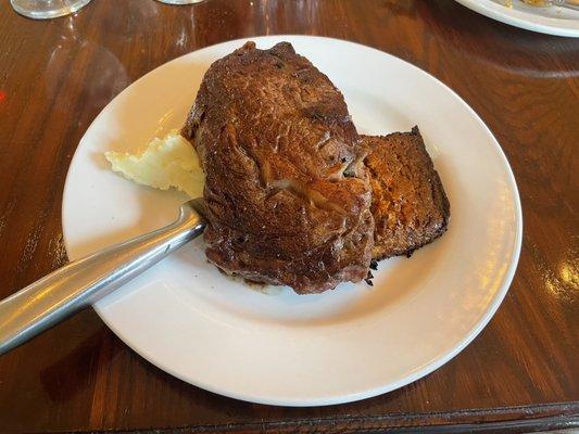 Ribeye steak with caramelized onion pudding and Yukon mashed potatoes.