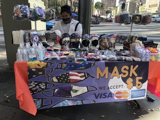 Masks for sale in front entrance to branch.