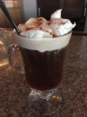 Delightful Irish coffee with fresh whipped cream on top.