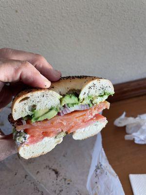 Lox and avocado on poppyseed bagel with green onion cream cheese. Awesome!