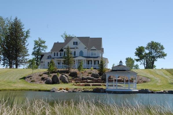 Beautiful custom home with trout pond.party barn,historic restored homestead cabin on 27 acres. Willow Ck