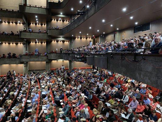 Taken from the second floor box area showing seating and audience from ground level, up.