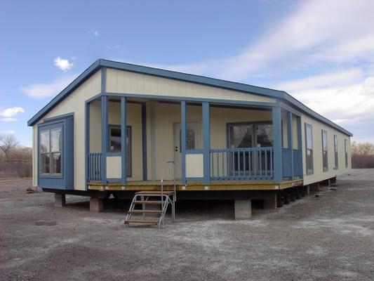 Blue Mobile Home. We set up and deliver throughout all of New Mexico.