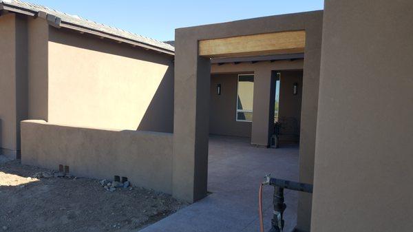 front yard walls with arch on the entry way