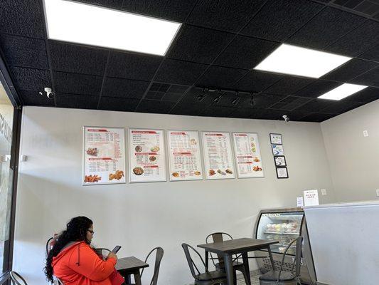 Menu on the wall to the left when you come in the door