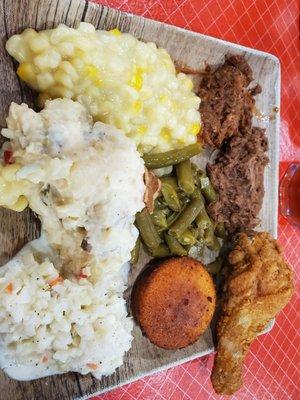 Clockwise - chipped pork, chipped mutton, fried chicken, cornbread muffin, green beans, slaw, potato salad cream corn