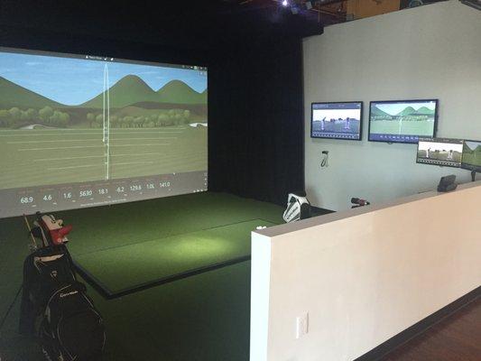 1 of 2 hitting bays. Both bays have Trackman radars, weight-sensitive floor mats, high-speed HD cameras, and more