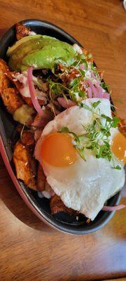 Red Chilaquiles Sunny Side Up with added chicken