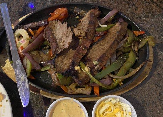 "Sizzling" steak fajitas... not so much.