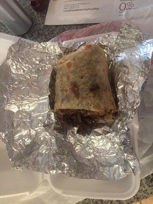 So full of meat that I could only eat half! This burrito FILLED the container!