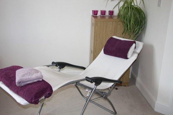 House visit reflexology and acupuncture setting. Zero gravity comfort setting frees your pain and stress.