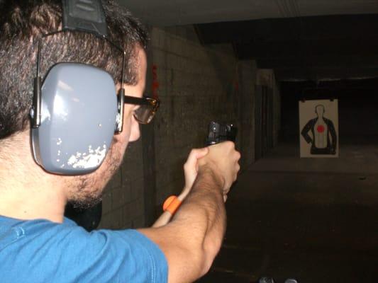 first time ever shooting a gun in my life. its a 45 mm. it was scary as it could be