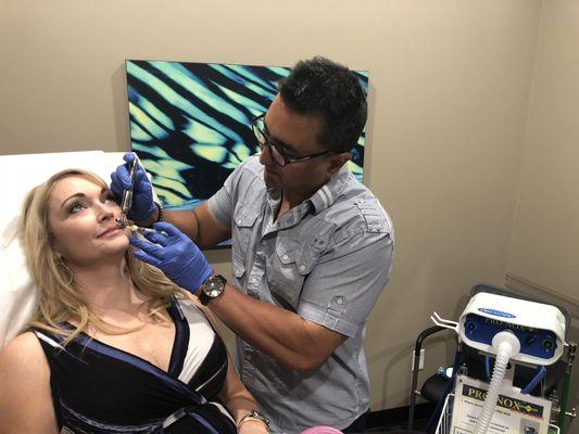 Dr. Perez performing lip augmentation with Juvederm Volbella for the soft, natural looking plump lips.