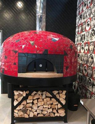 Our 100% wood fueled Italian oven fires your pizza to perfection.