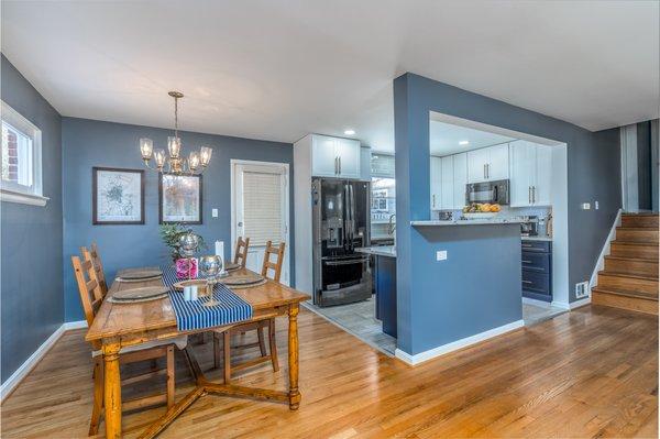 Kitchen remodel with blue cabinets,grey countertop,wooden flooring,Silver Spring