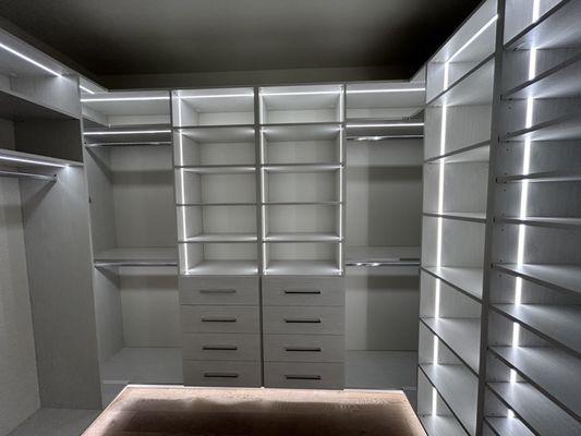 Custom closet with integrated lighting.