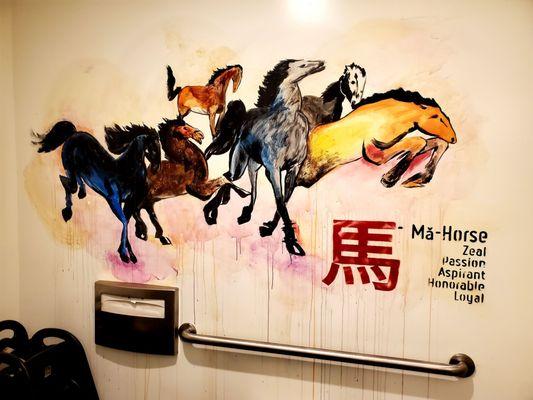 Cool Running Horses mural inside the Women's Restroom. Clean, nicely stocked and maintained.