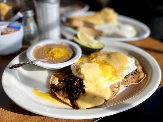 Papi's Huevos! Ole! Crispy corn tortillas 2 eggs over easy chorizo, beans queso salsa avocado & side of fresh jalapeño! :)...