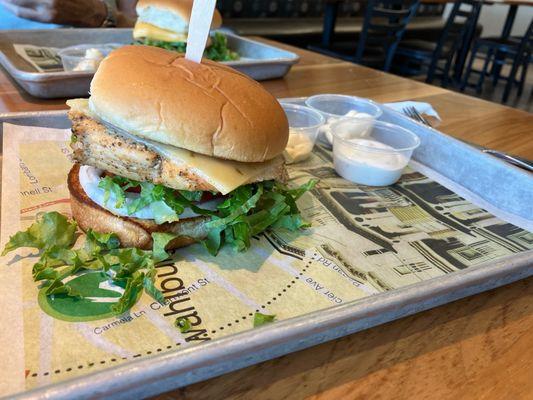 Grilled chicken burger with lettuce, tomato, and pepper jack chees. Ranch dressing on the side. Yum!