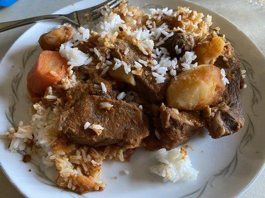 Beef stew over white rice