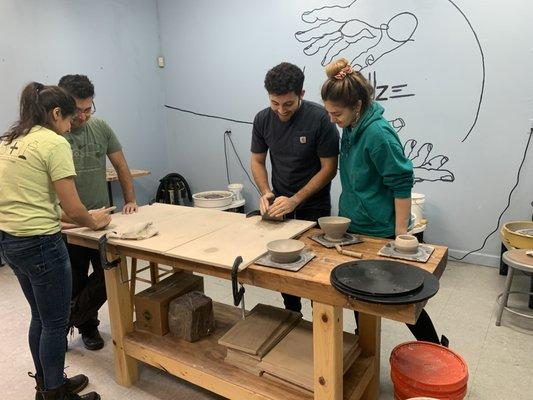 New students at the pottery wheel class!