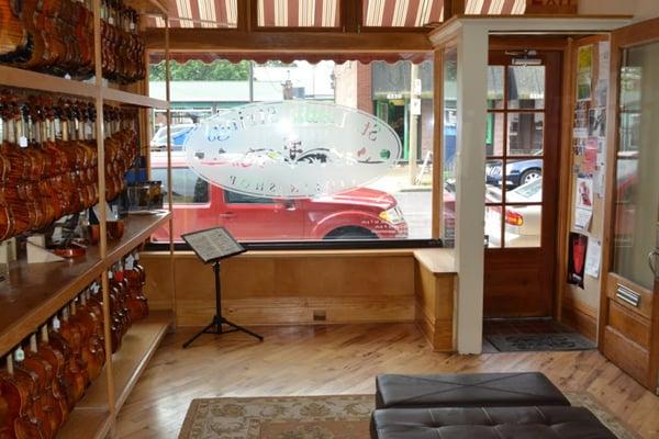 Another room with assortment of instruments at St. Louis Strings