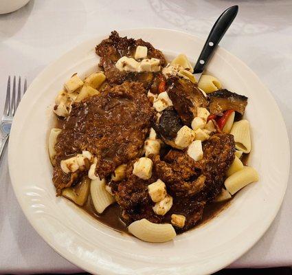 Veal savoia, sautéed in balsamic sauce with roasted peppers, fresh mozzarella and portobello mushrooms, over rigatoni