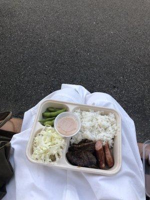 Kalbi BBQ Box! Comes with white rice, cabbage, edamame, and two pieces of Japanese sausage.