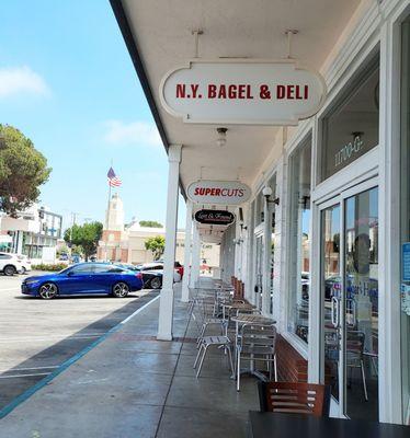 This place is on  Nat'l & Barrington, across from Whole Foods.  Also, in this picture, you can see that they have tables and chairs outside