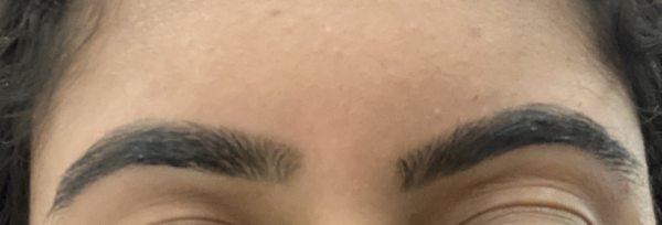 Final result of threading (one eyebrow is higher than the other)