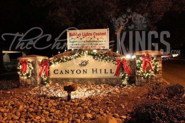 Monument Sign with Lit up Garland and Bows