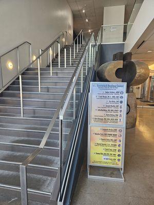 The stairs to the 2nd floor of Plaza Towers. If you are standing here, look behind you for an elevator to the 2nd floor.