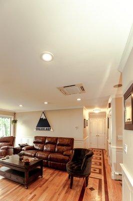 Ceiling mounted Mitsubishi.  Saves wall space.  Still great rebates.