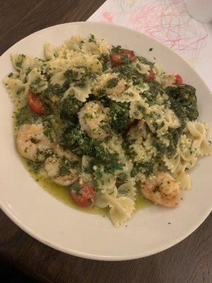 Grilled shrimp with bowtie pasta pesto and broccolini.