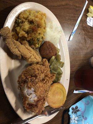 Fried chicken, catfish, hush puppy, green beans, cornbread, mashed potatoes, and squash casserole.